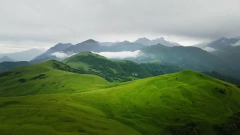 Green mountains with clouds at sunset. Stock Footage 232198905
