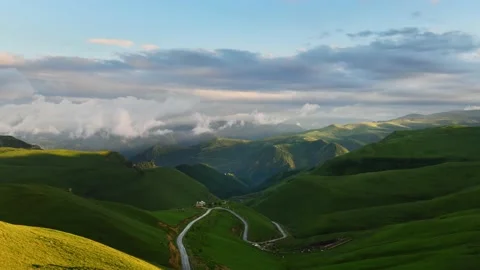 Green mountains with clouds at sunset timelapse. Video stock 219963087