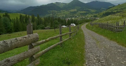 Green mountains. Cloudy sky and hills meadow. Panning. Forest in the mountains Video stock 77277756