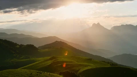 Green mountains in the evening sunlight timelapse. Stock Footage 219962738
