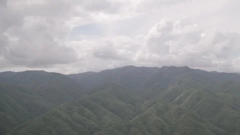 Green mountains full of nature on a beautiful sunny day Stock Footage 304096584