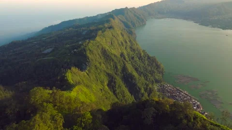 Green mountains with a lake on a background of clouds Stock Footage 315402683