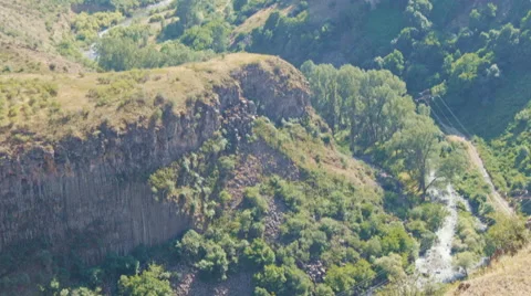 Green mountains, small river and rocks from a viewing platform in Garni, Armenia Stock Footage 65378725