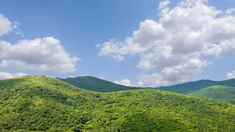 Green mountains under a dense clouds time lapse scene Stock Footage 279181217