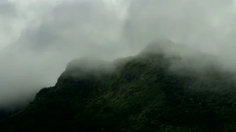 Green mountains in wind driven clouds Stock Footage 41380385
