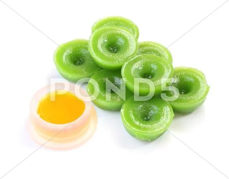 Green multiple scented chinese sweet and liquid sugar on white floor. Stock Photos