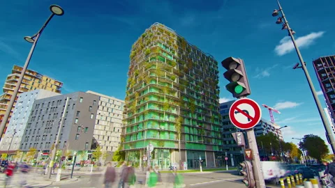 A green, natural facade of a building made of plants on a Paris street. The Stock Footage 320417497