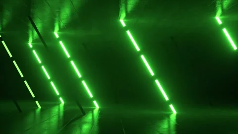 Green neon illumination casting vibrant, geometric patterns across reflective Stock Footage 313383082