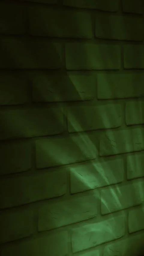 Green neon light on brick wall background, abstract urban texture and modern des Stock Footage 335365070