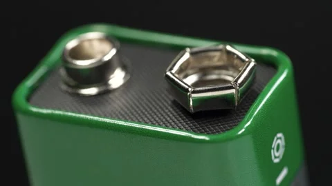Green nine volt battery for powering electronic devices Stock Footage 346081713