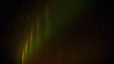 Green northern lights dancing in the starry Iceland sky Vídeos de archivo 330283146