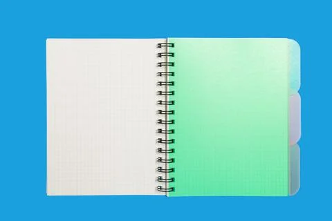 Green notebook on a blue background Stock Photos