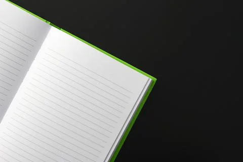 Green notebook with text lines on white paper Stock Photos