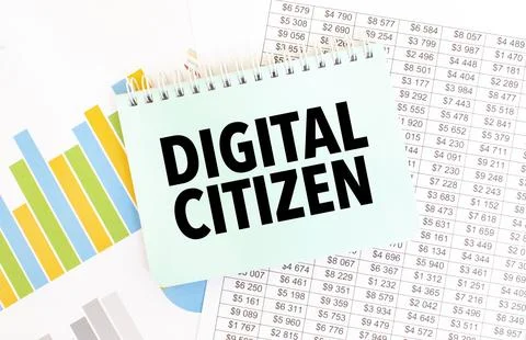 Green notepad on financial documentation. Text DIGITAL CITIZEN. Business co.. Stock Photos