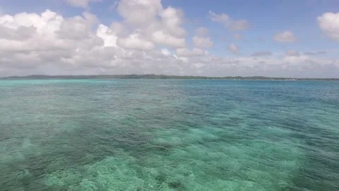 GREEN OCEAN BEACH FLYING TOWARDS LAND Stock Footage 130511606