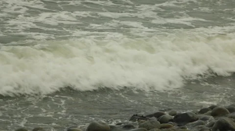 Green Ocean Waves Crash Against Rocks on Coast, Realtime Video stock 48253479