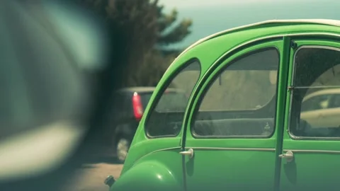 Green old timer shoot through a car Stock Footage 229192630
