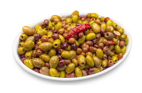 Green olive salad background with a chilli on top dish Foto stock