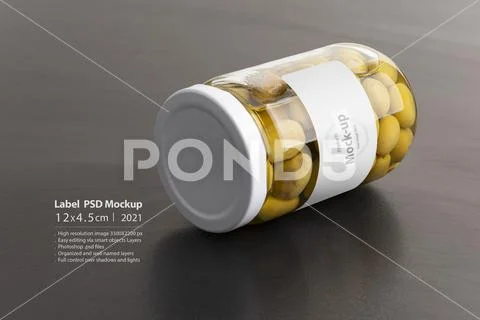 Green olives conserve with round cap on black table mock-up series PSD Template