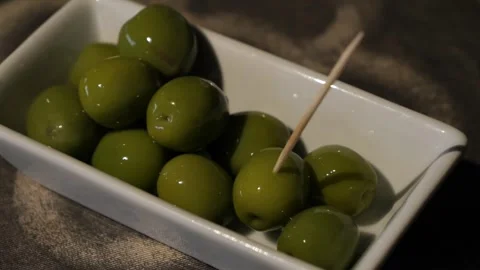 Green olives on the plate close up. Stock Footage 300478676