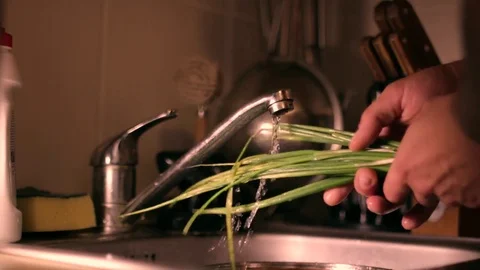 Green onion washing in the kitchen Stock Footage 80991243