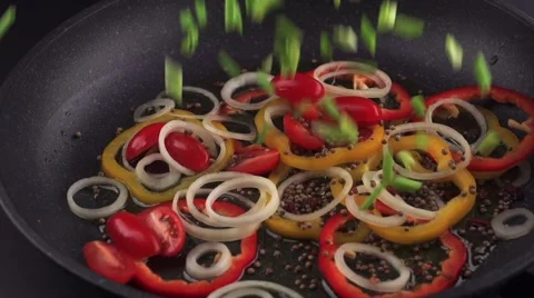 Green onions are falling in a sliced bell peppers Stock Footage 58108986