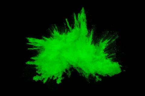 Green orange dust particles explosion on black background. Color powder dus.. Stock Illustration