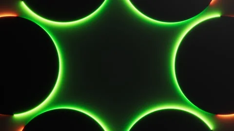 Green orange neon light is moving around black round frames on dark background Stock Footage 326778965