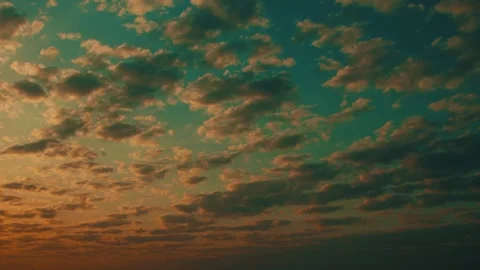 Green orange sunrise - time-lapse with movement of clouds on sky Stock Footage 254968199