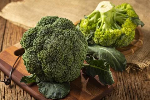 Green organic broccoli on the table. Stock Photos