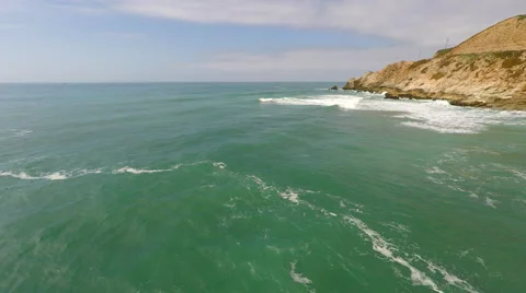 Green Pacific Ocean tracking shot from Ocean to shore break Stock Footage 62472091