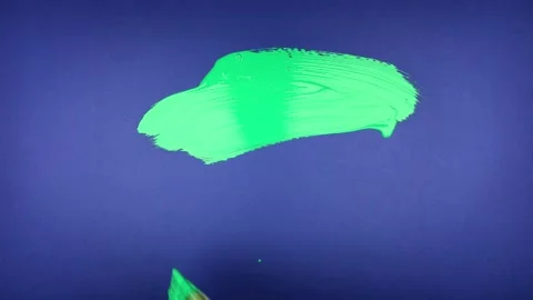 Green paint on blue screen paint brush #6 Stock Footage 221427099