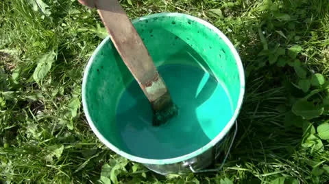 Green paint in the bucket Stock Footage 24695841