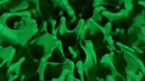 Green paint dances up and down shot overhead in slow motion Stock Footage 63991732