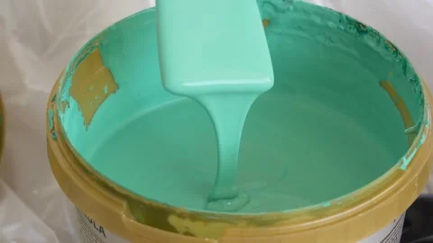Green paint is mixed in a jar before use. Stock Footage 252736010