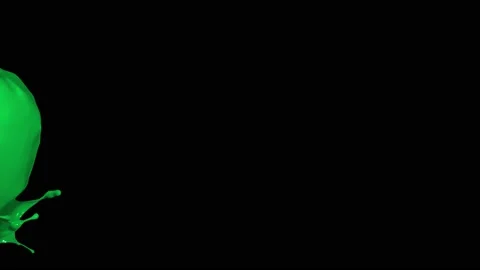 Green paint splash thrown in slow motion, liquid isolated on black (4K) Stock Footage 137111545