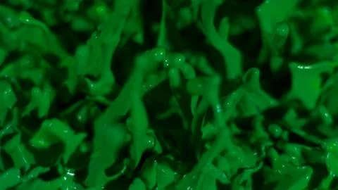 Green paint splatter background, macro texture Stock Photos