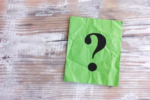 Green paper note with question mark Stock Photos