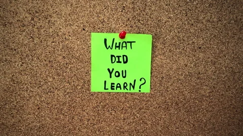 A green paper note with the question What did you learn written on it Stock Footage 295885293