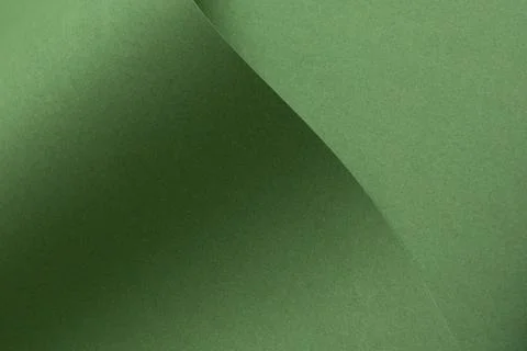 Green paper texture with diagonal shadow and smooth surface. Minimal abstract 库存照片