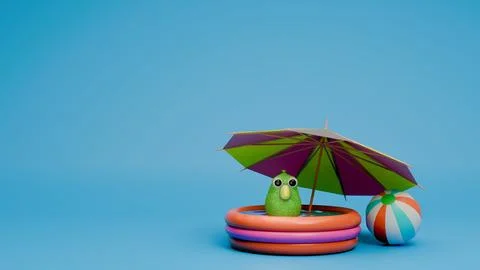 Green parrot inside pool under beach umbrella with beach ball Stock Photos