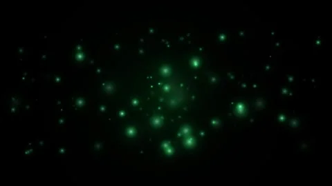 Green particle glow floating in slow motion on black background with abstra.. Video stock 344996577