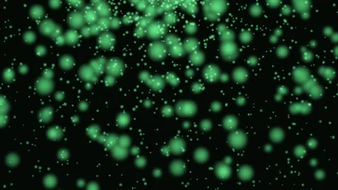 Green particles floating in darkness with cinematic motion and negative spa.. Stock Footage 343419780
