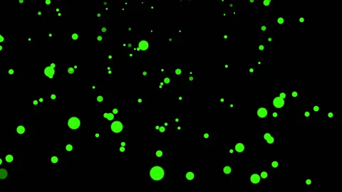 GREEN particles glowing on the black background. Black background with light  Stock Footage 218576094