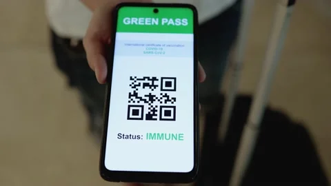 GREEN PASS Qr code digital certificate for coronavirus vaccine on mobile phone Stock Footage 168250637