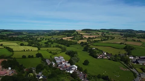 Green Patchwork Farmland and Small Hamlet in Rolling East Devon Countryside 動画素材 338060972