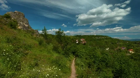 Green path winds through wild grass and trees. Vrmdza Fortress. Serbia Stock-Footage 338022158