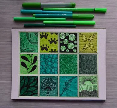 Green patterns hand drawn in twelve grid squares Stockfoto's