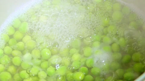 Green pea. Chef washes green peas for cooking vegetable stew, hostess prepares Stock Footage 160183792