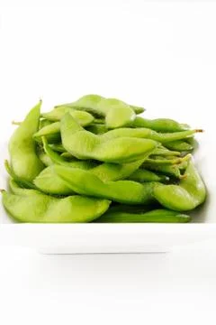 Green pea on dish Stock Photos